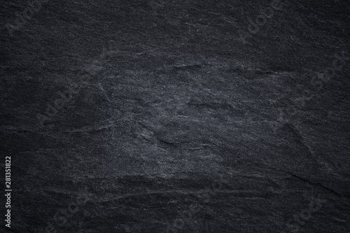 Dark grey black slate background or natural black stone texture