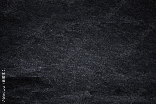 Dark grey black slate background or natural black stone texture