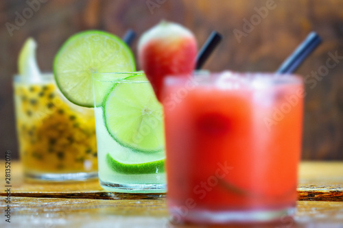 Traditional brazilian caipirinha alcoholic cocktail with sugar, mint and brown sugar. Fruit with cachaça, Brazilian tradition.