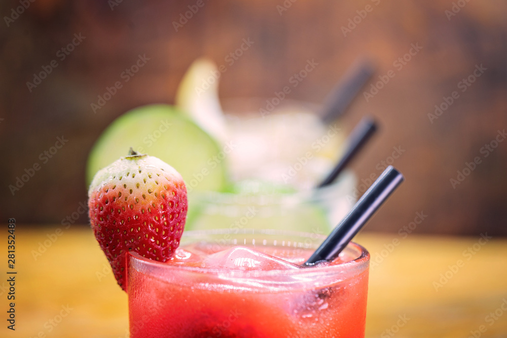 Traditional brazilian caipirinha alcoholic cocktail with sugar, mint and brown sugar. Fruit with cachaça, Brazilian tradition. Traditional brazilian caipirinha alcoholic cocktail with sugar, mint and brown sugar. Fruit with cachaça, Brazilian tradition.