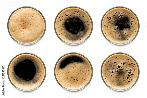 Canvas Print Glass of dark stout beer with foam assortment top view collection isolated on white background