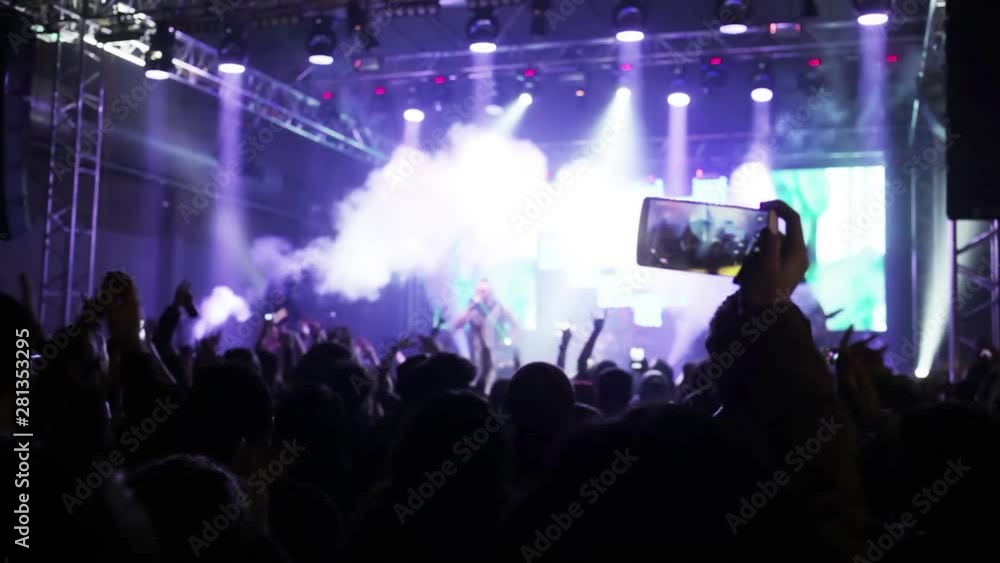 Live Concert , Fans Dancing Excitedly During Concert is a wonderful stock video that features footage of a live performance. The pulsing spotlights show the silhouette of the audience dancing Live Concert , Fans Dancing Excitedly During Concert is a wonderful stock video that features footage of a live performance. The pulsing spotlights show the silhouette of the audience dancing
