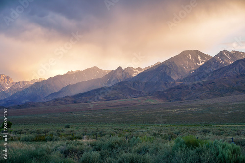 Mountain range colorful sunset with clouds before storm   Eastern Sierra Mountains  Mono County  California  USA