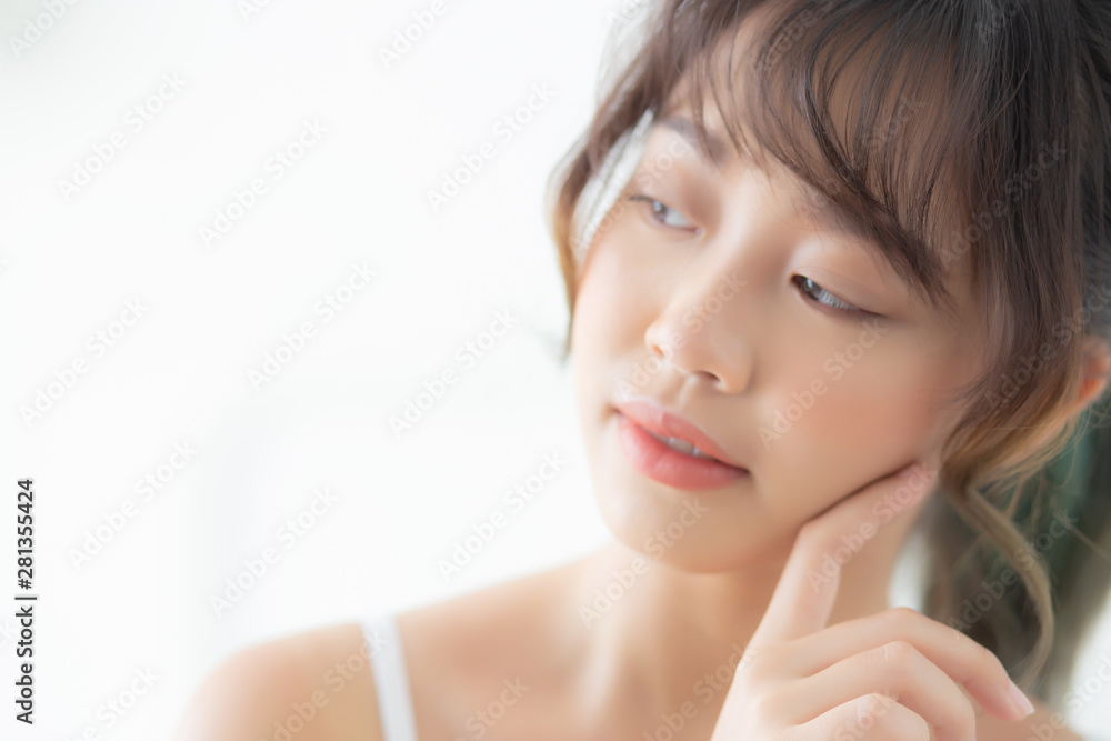Portrait of beautiful young asian woman smile while wake up healthy and wellness with sunrise at morning in the bedroom, asia girl skin care with happy with fresh, lifestyle and relax concept. Portrait of beautiful young asian woman smile while wake up healthy and wellness with sunrise at morning in the bedroom, asia girl skin care with happy with fresh, lifestyle and relax concept.