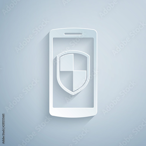 Paper cut Smartphone, mobile phone with security shield icon isolated on grey background. Paper art style. Vector Illustration