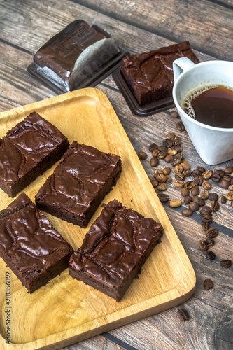 Nutella Brownie with americano coffee and coffee bean on the wood table
