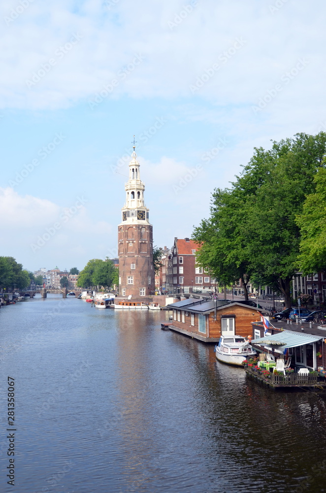 The Montelbaanstoren tower on Oudeschans canal in Amsterdam, Netherlands, built in 1516 for the purpose of defending the city 