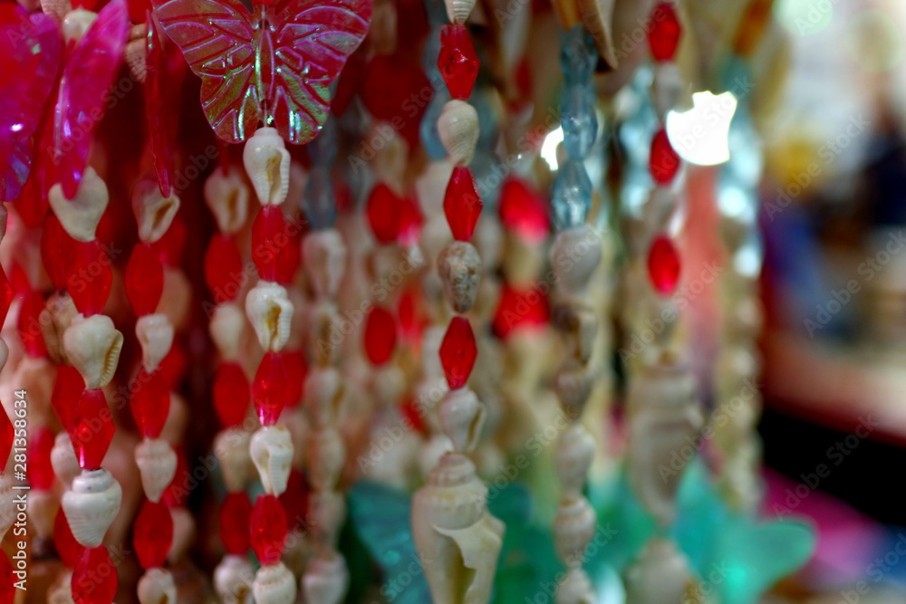 Home decoration of beads made from sea shells, photographed with a blur and bokeh background Home decoration of beads made from sea shells, photographed with a blur and bokeh background