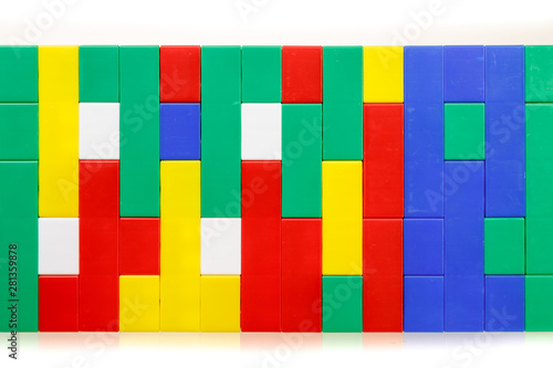 Children's colorful plastic construction toy bricks on white