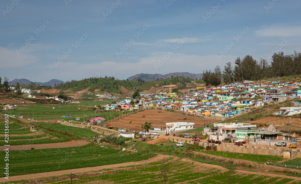 small village on hill top with green forest of western ghat