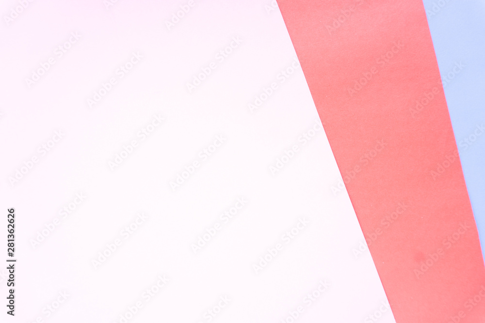 Flat layout of minimal colourful layer of pastel pink, red and purple paper background.