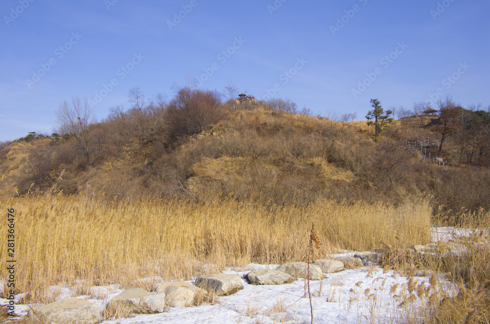 hill under blue sky