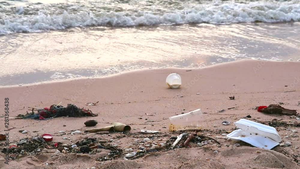 sunset on sea with plastic and waste on the beach and the waves blew them into the sea sunset on sea with plastic and waste on the beach and the waves blew them into the sea
