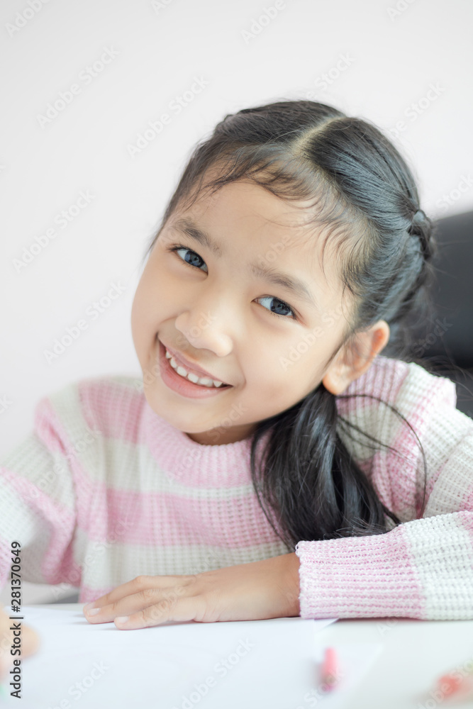 Little Asian girl doing homework for education concept select focus shallow depth of field Little Asian girl doing homework for education concept select focus shallow depth of field