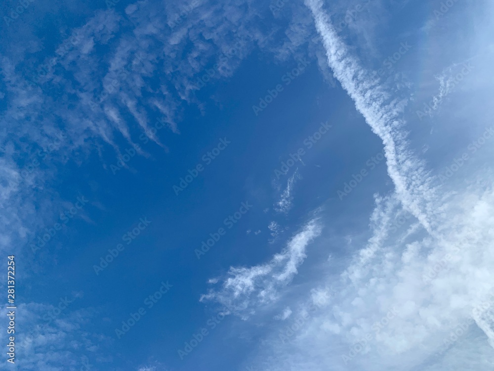 White clouds floating in the blue sky, the stratus cloud as abstract background