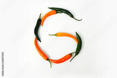 English alphabet. Letter G made of fresh chili pepper isolated on white background. Uppercase letter.