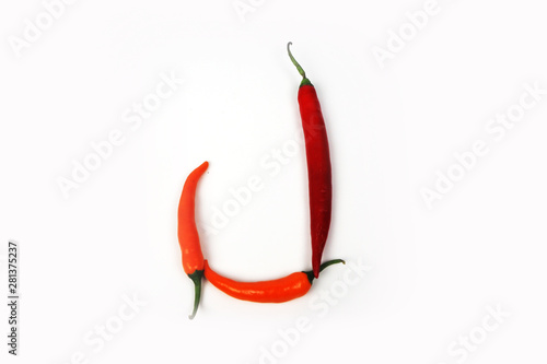 English alphabet. Letter J made of fresh chili pepper isolated on white background. Uppercase letter.