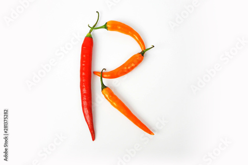 English alphabet. Letter R made of fresh chili pepper isolated on white background. Uppercase letter.