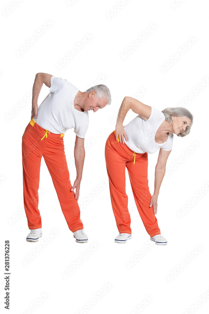 Obraz premium Portrait of Senior couple exercising isolated on white background