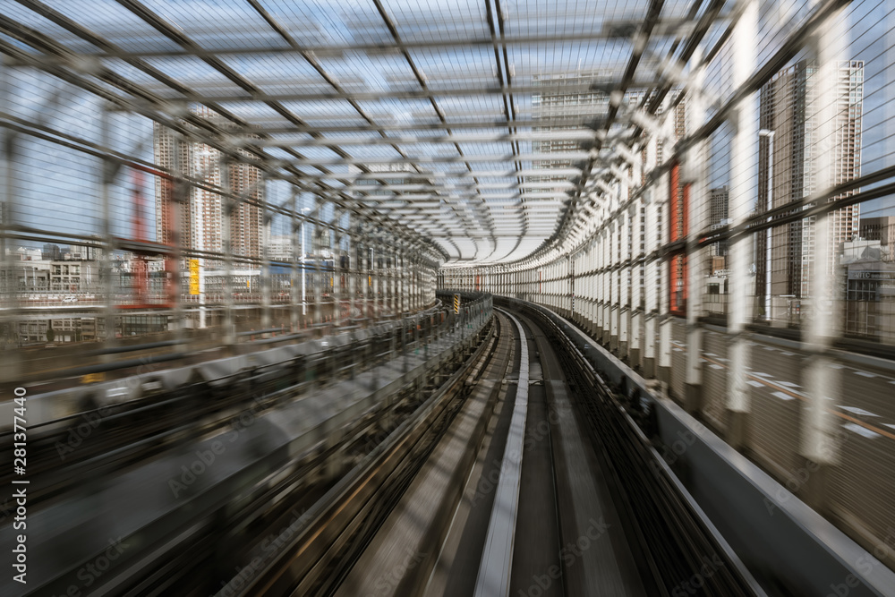 Fototapeta premium motion-blurred view from a moving train running in tunnel