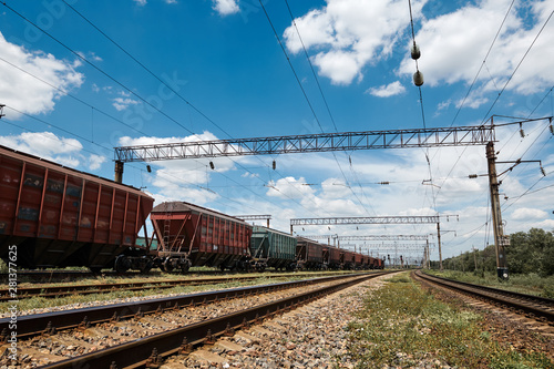 Industrial railway - wagons, rails and infrastructure, electric power supply, Cargo transportation and shipping concept.