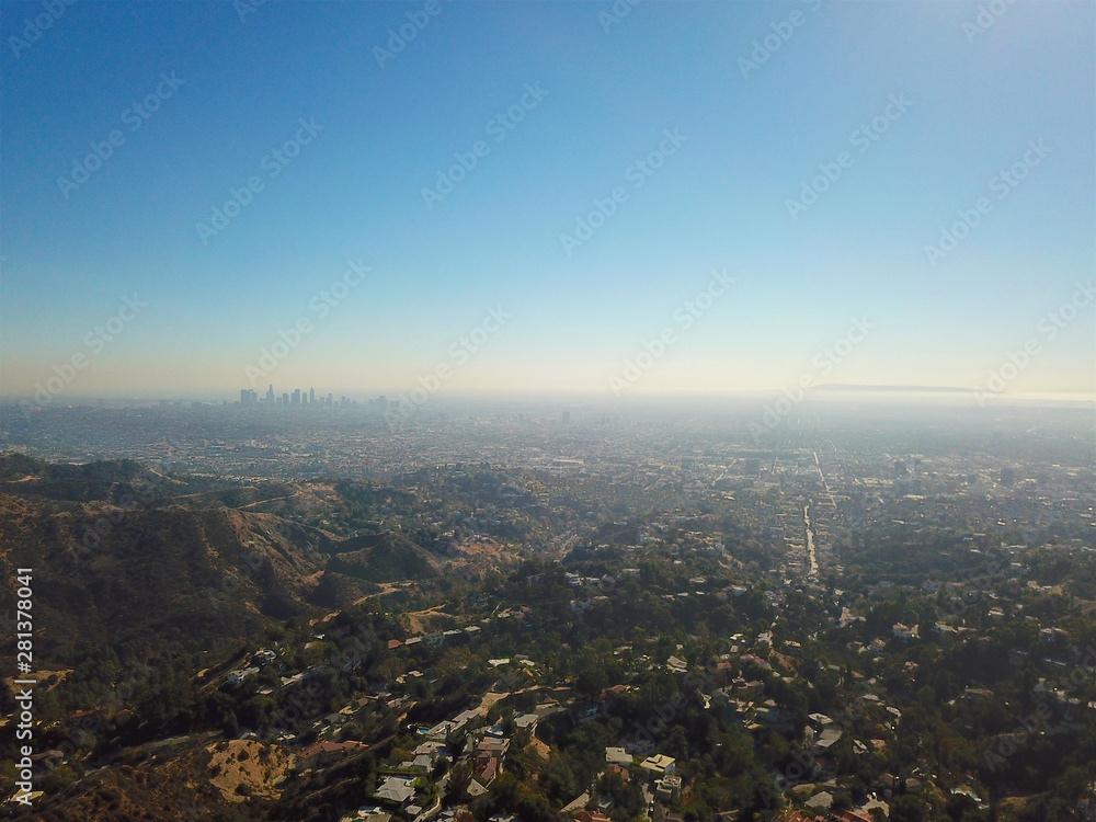 Aerial view of Hollywood valley and Los Angeles city. During blue sunny summer day. Los Angeles, California, USA. Aerial view of Hollywood valley and Los Angeles city. During blue sunny summer day. Los Angeles, California, USA.
