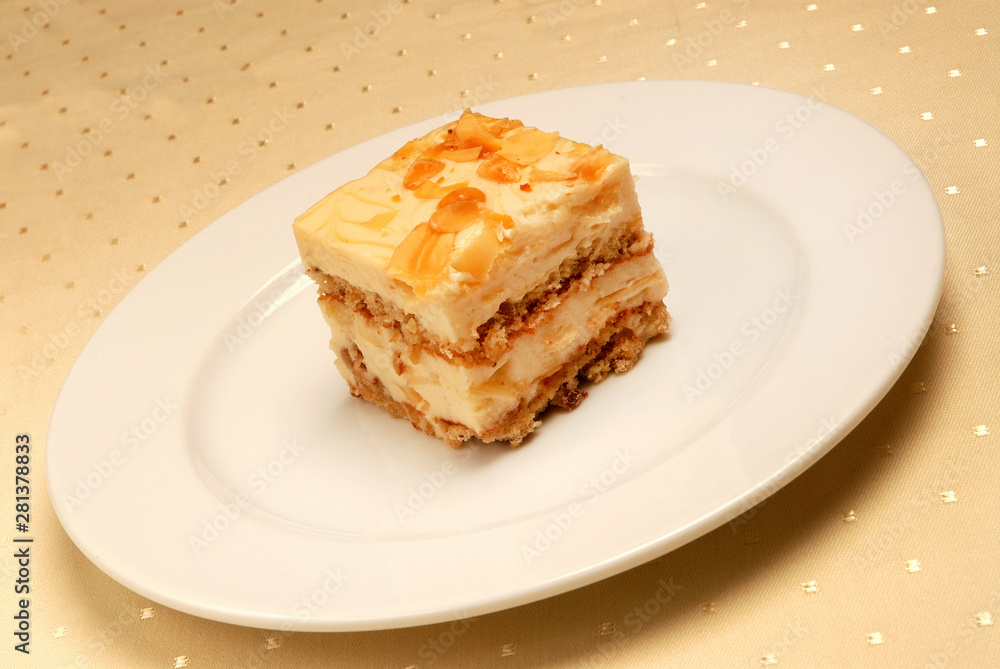 Slice of delicious coconut cake on a white plate Slice of delicious coconut cake on a white plate