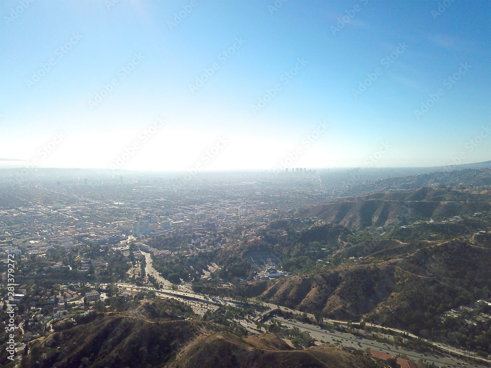 Aerial view of Hollywood valley and Los Angeles city. During blue sunny summer day. Los Angeles, California, USA. Aerial view of Hollywood valley and Los Angeles city. During blue sunny summer day. Los Angeles, California, USA.