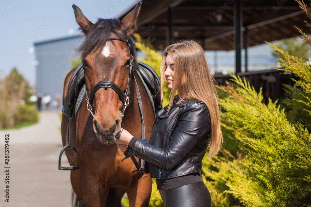 Obraz premium Girl with a horse, countryside place, woman talking to her horse. Portrait of riding horse with woman at rancho 