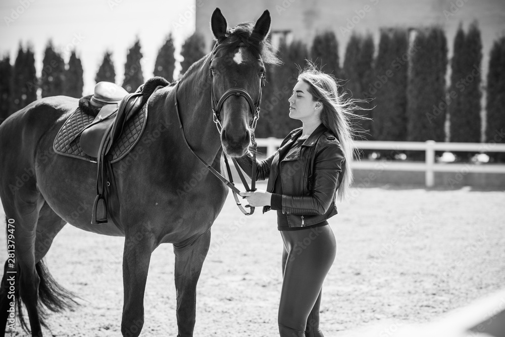 Obraz premium Girl with a horse, countryside place, woman talking to her horse. Portrait of riding horse with woman at rancho