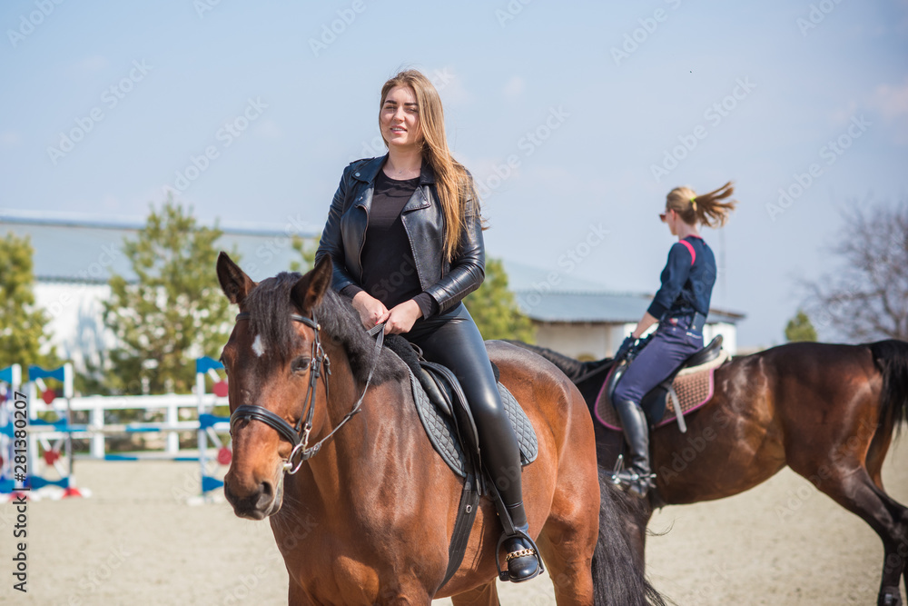 Fototapeta premium Girl with a horse, countryside place, woman talking to her horse. Portrait of riding horse with woman at rancho 
