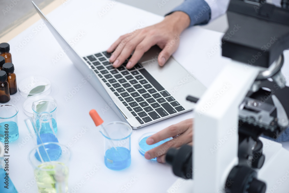 using laptop for working in laboratory using laptop for working in laboratory