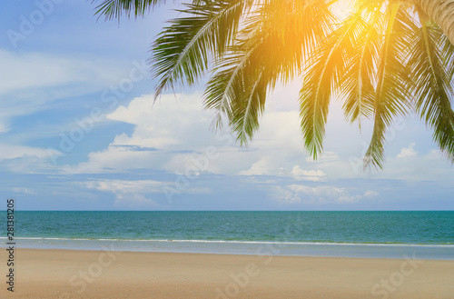 beautiful beach and tropical sea with palm trees in Thailand. Summer relax outdoor concept.