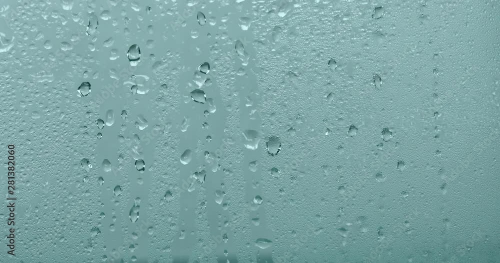 close up a steam mirror with rain drop on the glass window , rainy season background close up a steam mirror with rain drop on the glass window , rainy season background