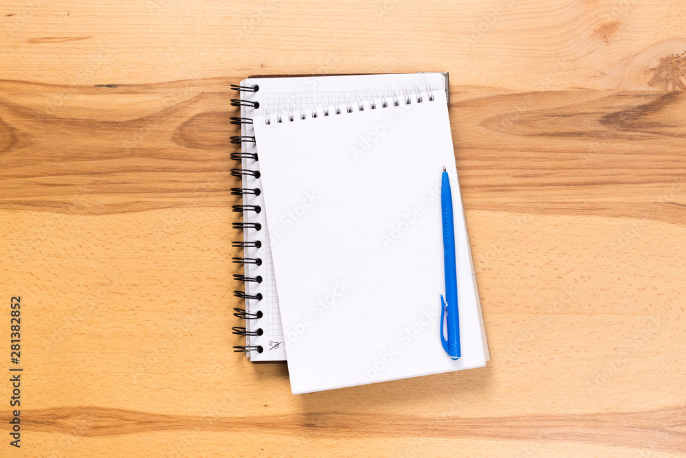 school notepad and pen on the wooden desk. spiral notepad on a tableschool notepad and pen on the wooden desk. spiral notepad on a table school notepad and pen on the wooden desk. spiral notepad on a tableschool notepad and pen on the wooden desk. spiral notepad on a table