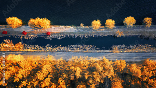 amazing autumn background with yellow trees and blue river.aerial view, birfd's eye, drone shot. photo