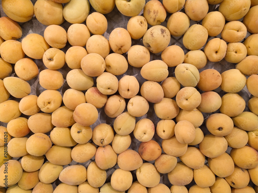Macro Photo food tropical fruit apricot. Texture background of sweet yellow ripe apricots. Image food fruit apricots Macro Photo food tropical fruit apricot. Texture background of sweet yellow ripe apricots. Image food fruit apricots