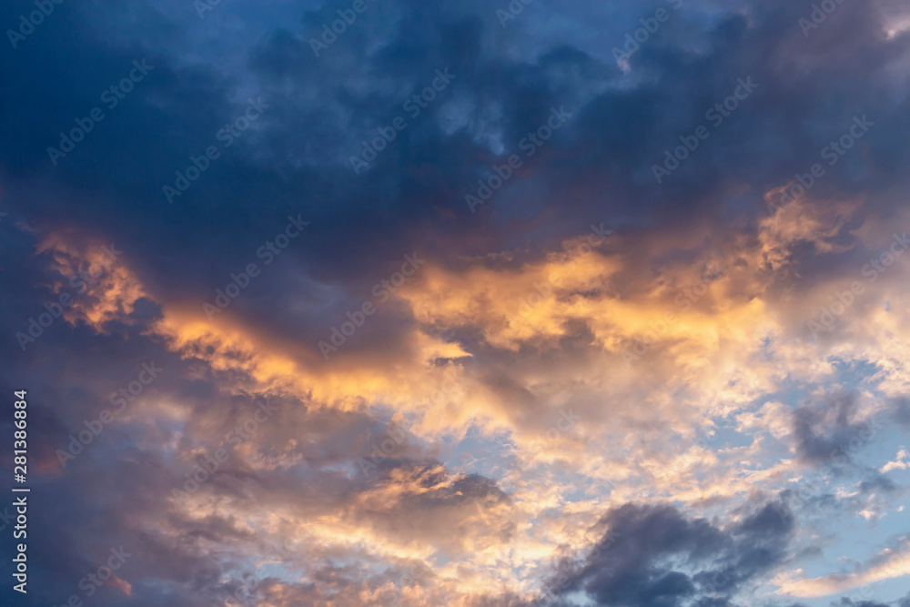 evening sky with clouds beautifully illuminated by the sun as a natural background evening sky with clouds beautifully illuminated by the sun as a natural background