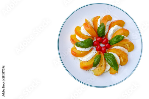 background of Mozzarella cheese and yellow tolatoes slice with basilic leaves and little red tomatoes. 