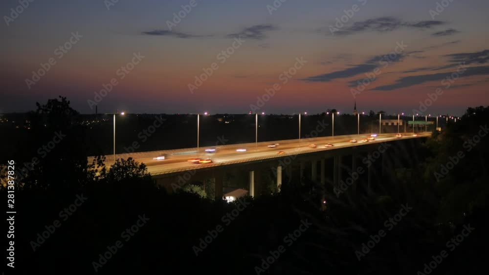 Time lapse of a sunset captured on a hill in Liljeholmen in Stockholm facing the motor highway Essingeleden.