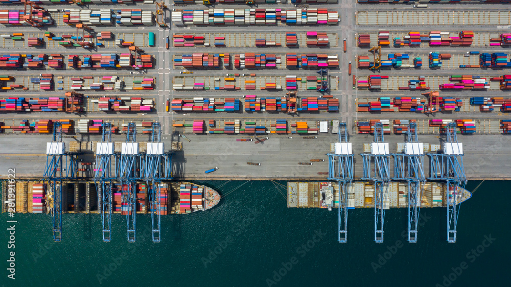 Aerial view cargo ship terminal, Unloading crane of cargo ship terminal, Aerial view industrial port with containers and container ship.
