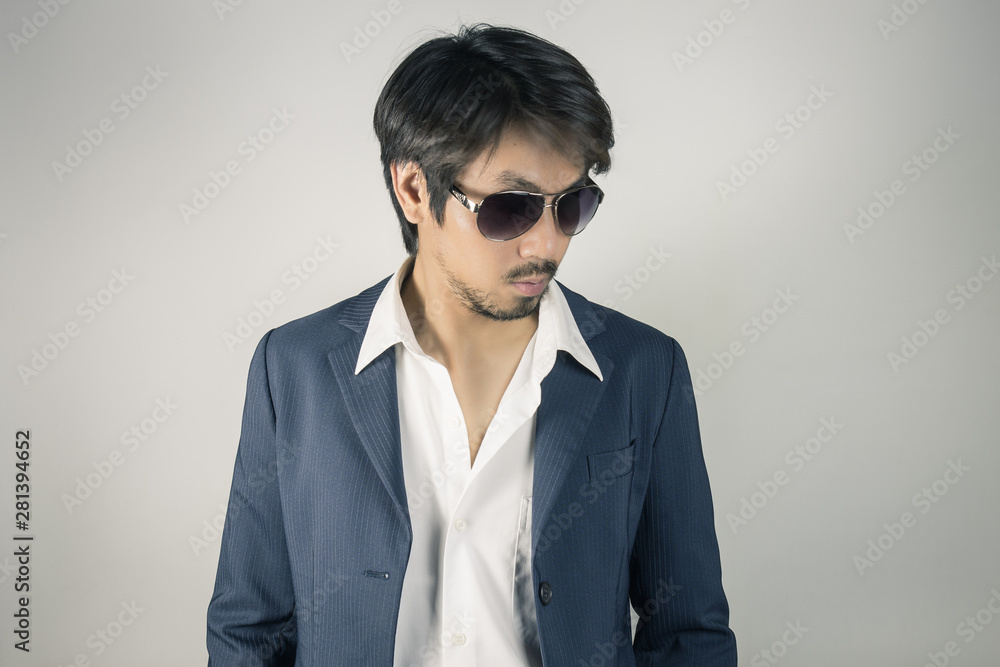 Portrait Man in Navy Blue Suit Wear Black Eyeglass or Eyewear Vintage Tone Portrait Man in Navy Blue Suit Wear Black Eyeglass or Eyewear Vintage Tone