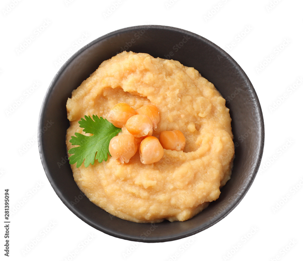 black bowl with chickpea hummus isolated on white background