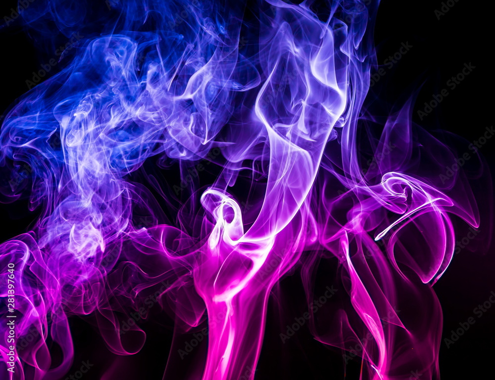 Fototapeta premium Colored smoke on black background