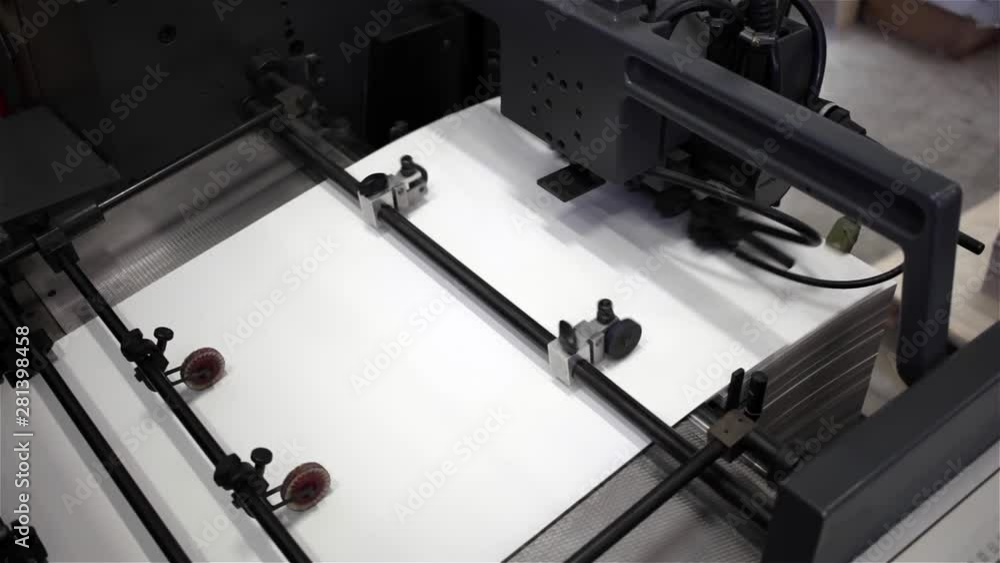Paper, Cardboard Factory features one step in the making of board sheets in a paper and cardboard factory machine. The cardboard are automatically folded as it passes through the wheels of the paper.