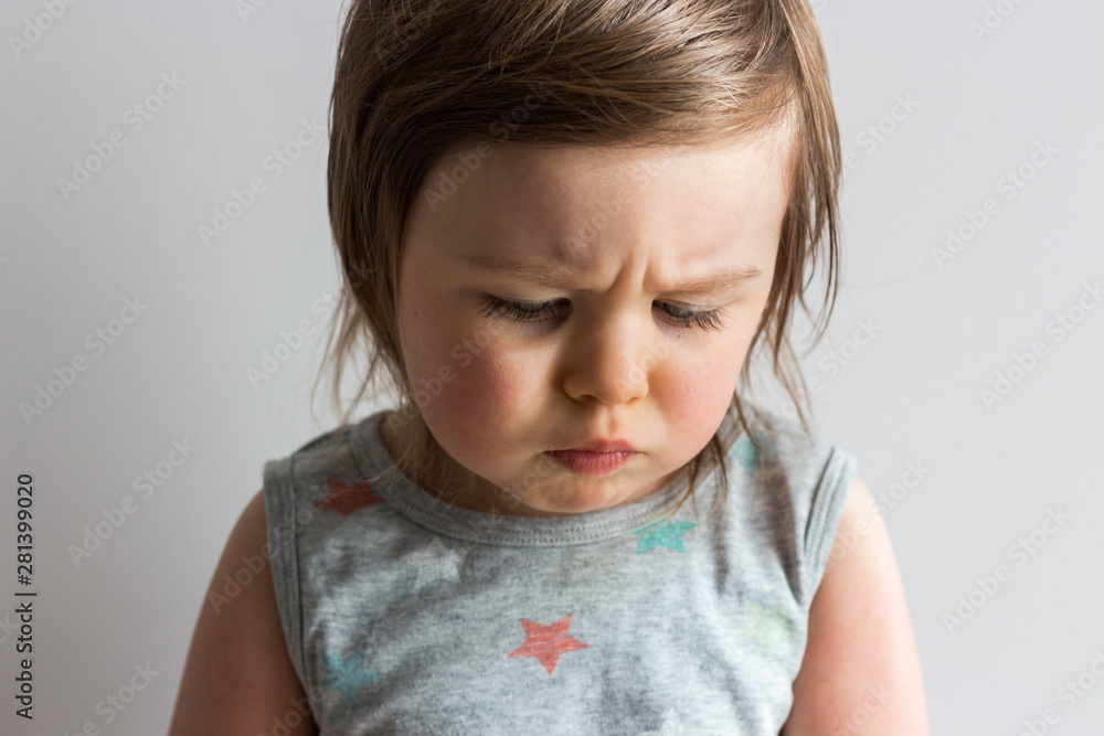 Naklejka premium Sad depressed offended toddler child crying with problems 