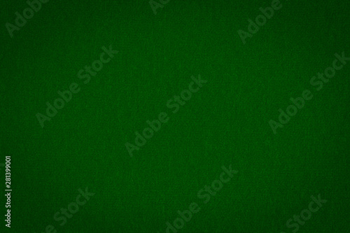 Texture of real dark green knitwear, textile background. Abstract background