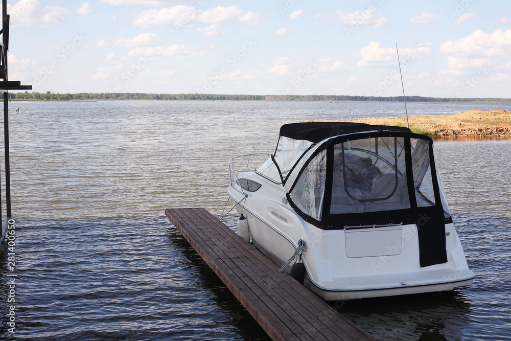 Boats parking - The modern boat on the mooring Boats parking - The modern boat on the mooring