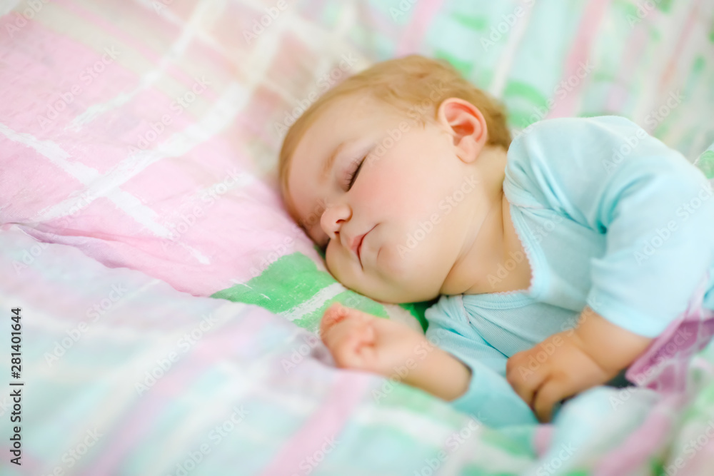 Adorable little baby girl sleeping in bed. Calm peaceful child dreaming during day sleep. Beautiful baby in parents bed. Sleeping together concept. Adorable little baby girl sleeping in bed. Calm peaceful child dreaming during day sleep. Beautiful baby in parents bed. Sleeping together concept.