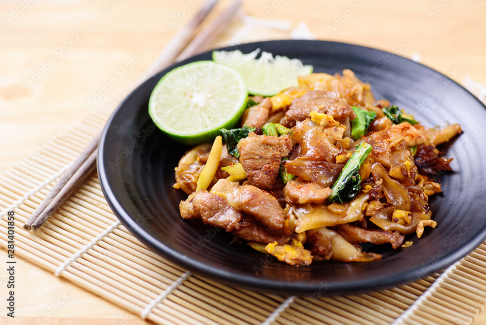 Thai food, stir fried rice noodle in soy sauce (Pad See Ew) Thai food, stir fried rice noodle in soy sauce (Pad See Ew)